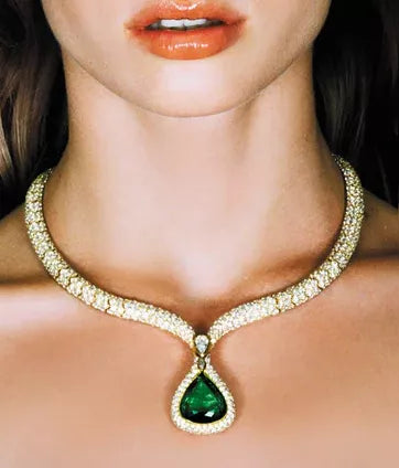 The Queen of Africa necklace is a superb one-of-a-kind piece extraordinarily crafted featuring hundreds of diamonds and an incredible emerald in the center from which the name derives.