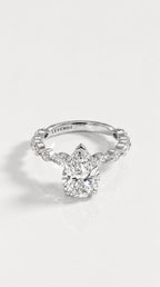 Pear Cut Diamond Engagement Ring with Marquise Band – front view