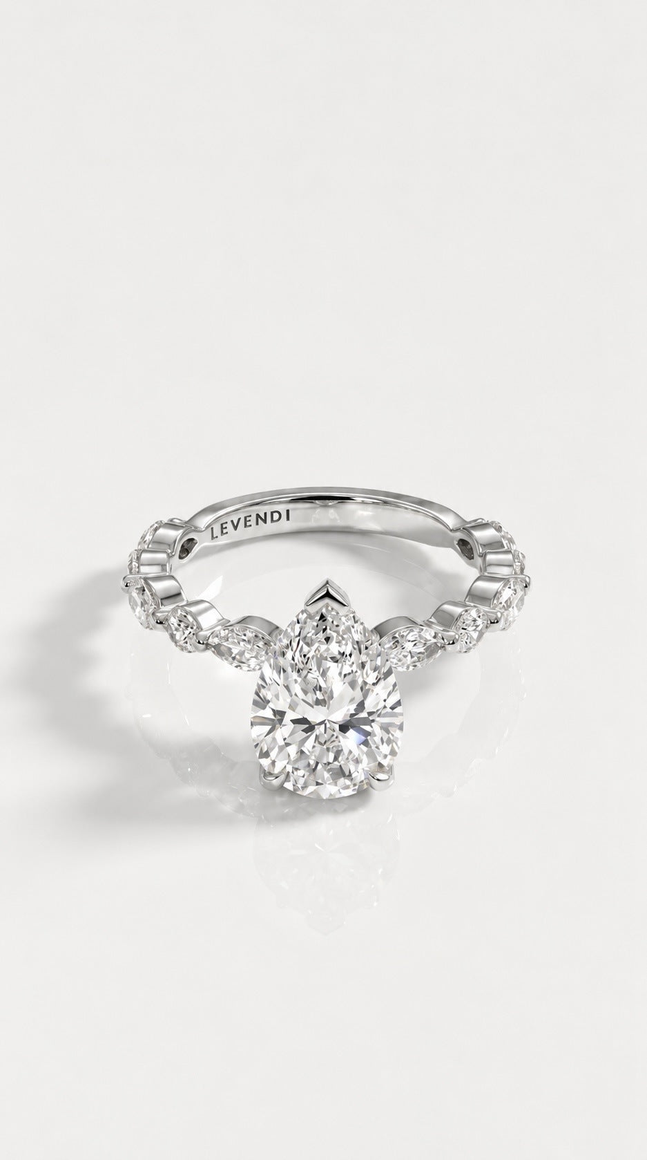 Pear Cut Diamond Engagement Ring with Marquise Band – front view