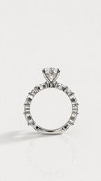 Pear Cut Diamond Engagement Ring with Marquise Band – side view