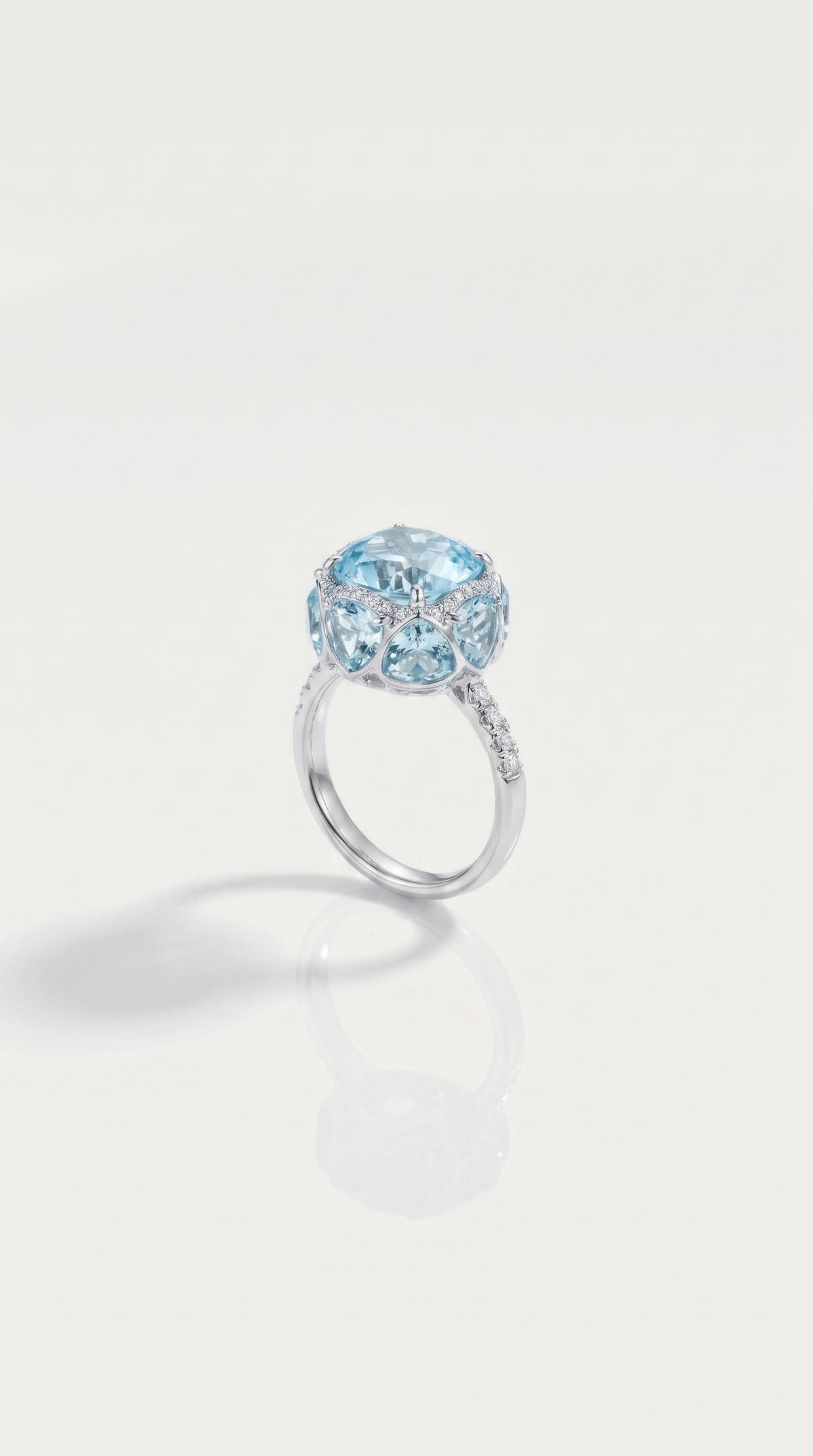 Sky Blue Topaz Hidden Halo 8 Topaz Trillion Cut & Diamond Ring, view 2 — Levendi Jewellers