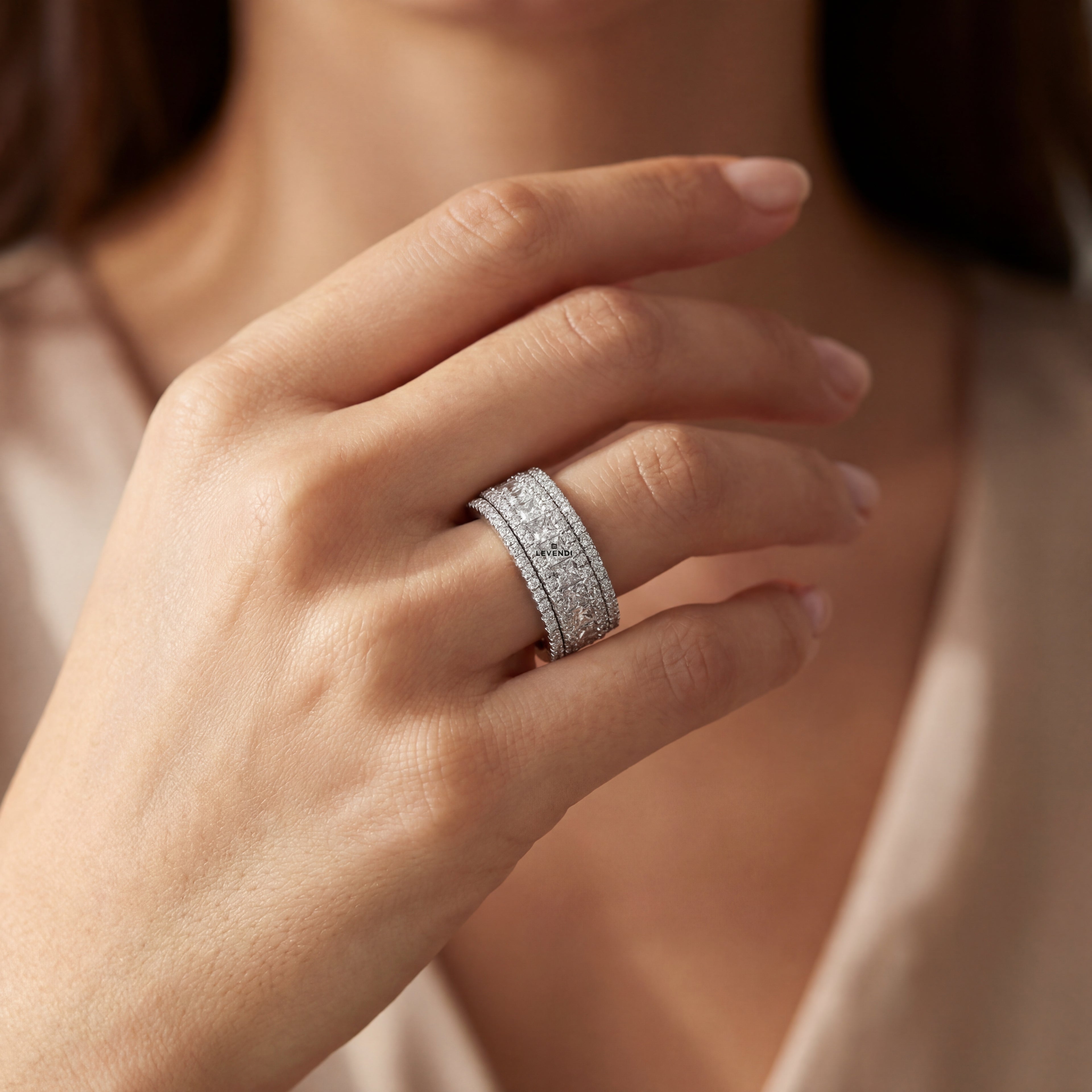 White Gold Channel Set Diamond Band with Round and Princess Cut Diamonds.