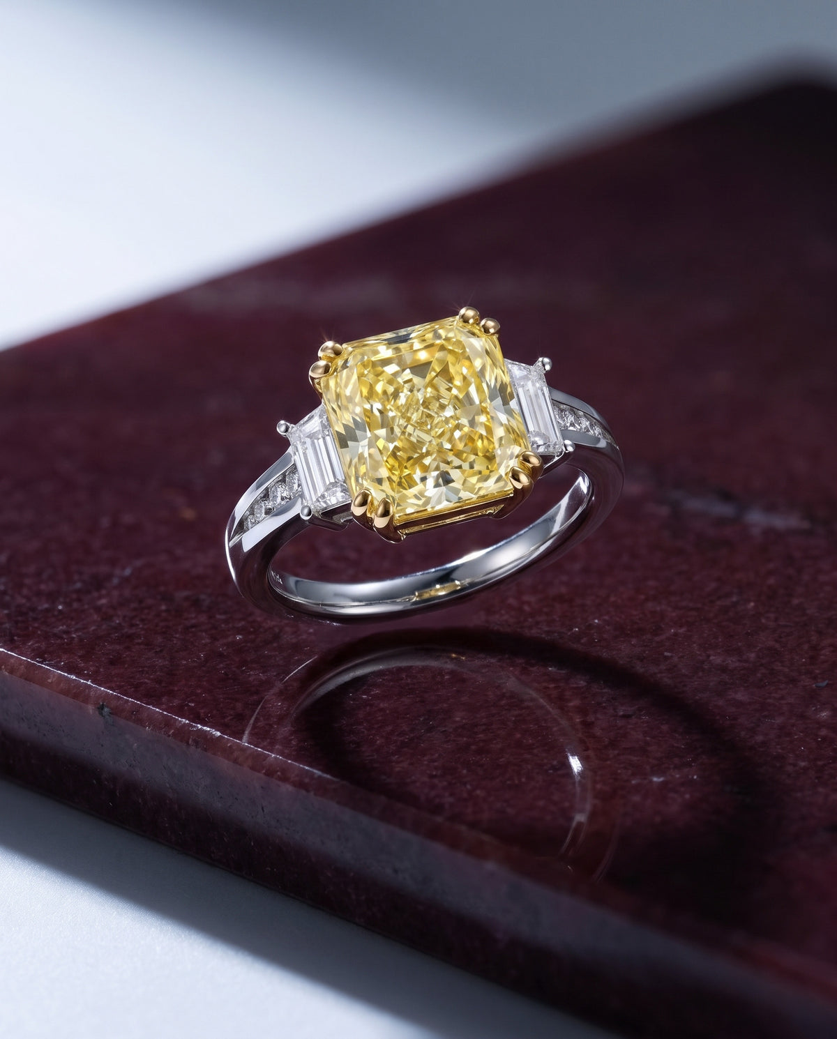 Canary Dream Trilogy Yellow Diamond Engagement Ring — Levendi Jewellers, on burgundy stone