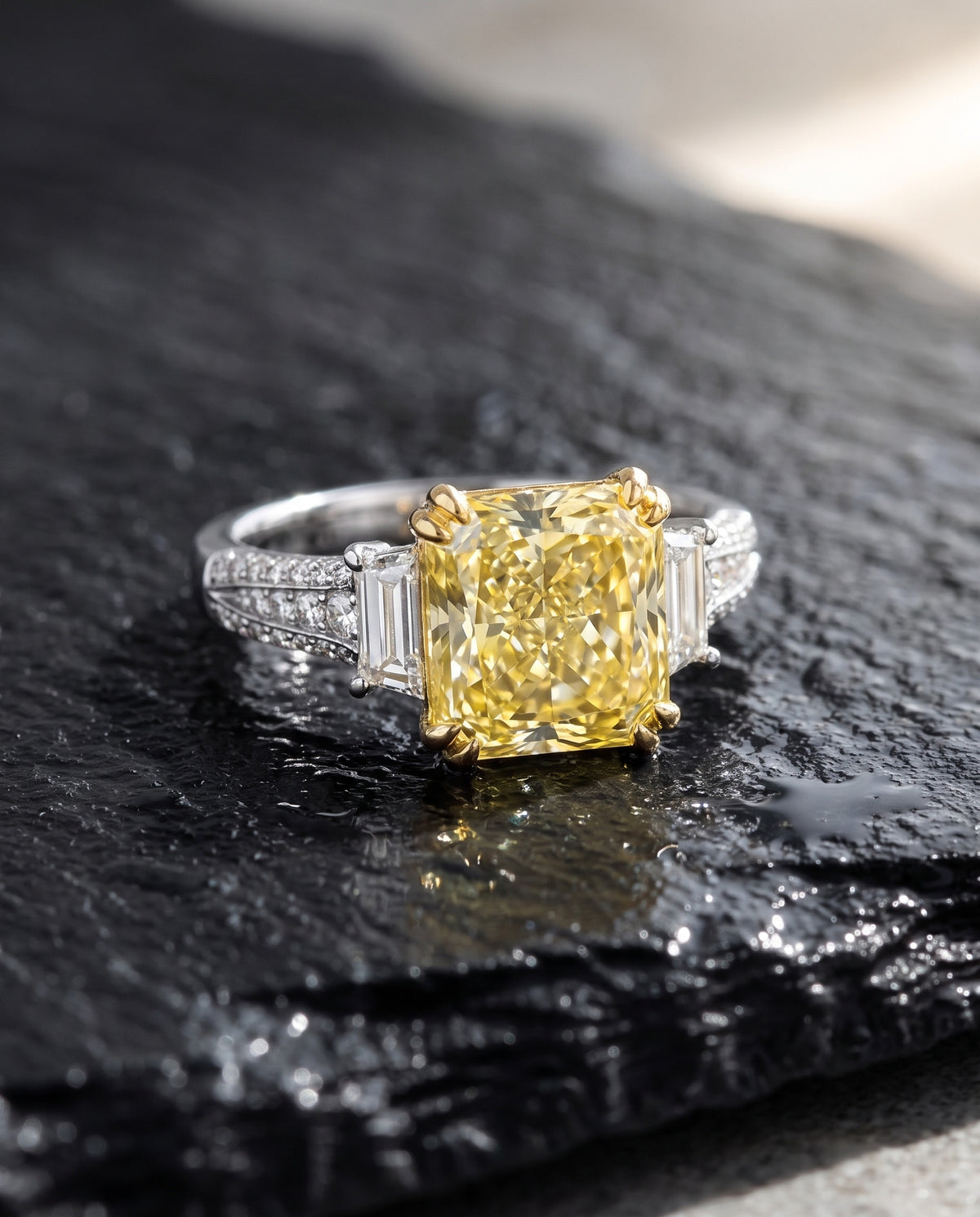 Canary Dream Trilogy Yellow Diamond Engagement Ring — Levendi Jewellers, on wet black slate