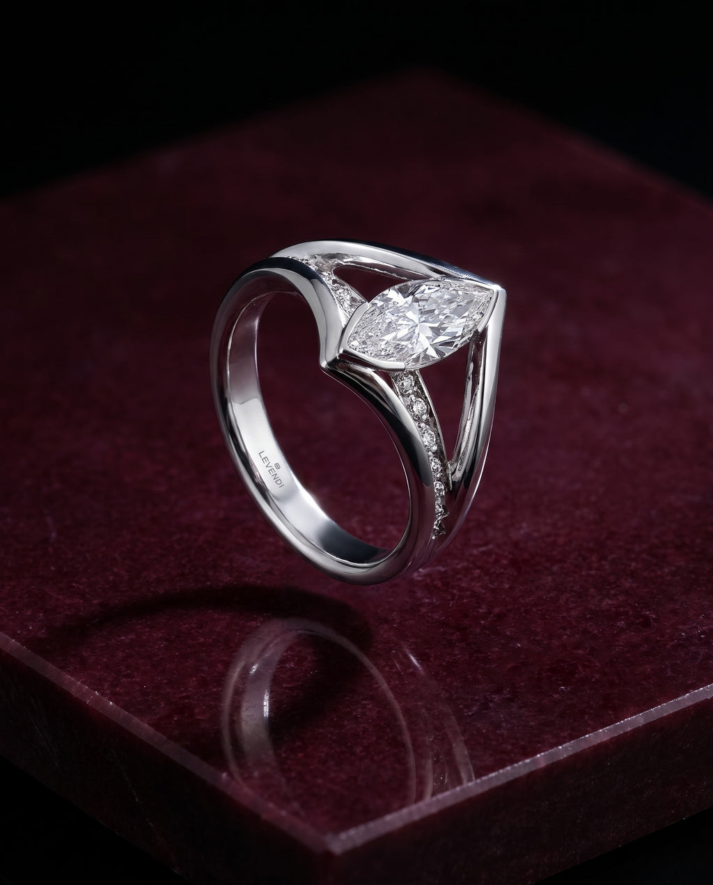 The Ellipse - Marquise Diamond Ring — Levendi Jewellers, on burgundy stone