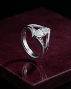 The Ellipse - Marquise Diamond Ring — Levendi Jewellers, on burgundy stone
