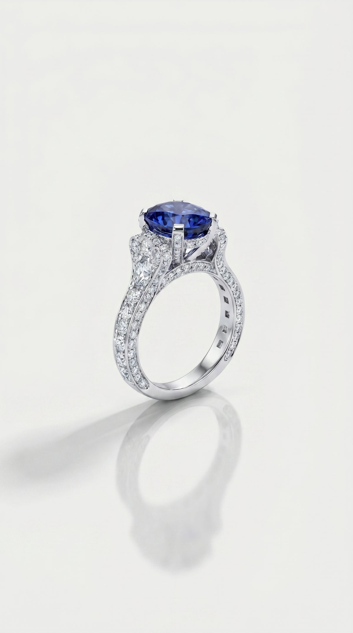 Deep Blue Sapphire & Diamond Pavee Hidden Halo Ring, view 2 — Levendi Jewellers
