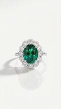 Oval Cut Emerald & Diamond Halo Ring