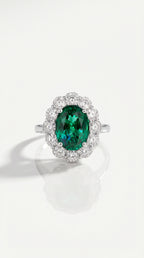 Oval Cut Emerald & Diamond Halo Ring — Levendi Jewellers