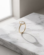 Levendi Wave of Love - Oval Cut Bezel Set Engagement Ring — Levendi Jewellers, on stone