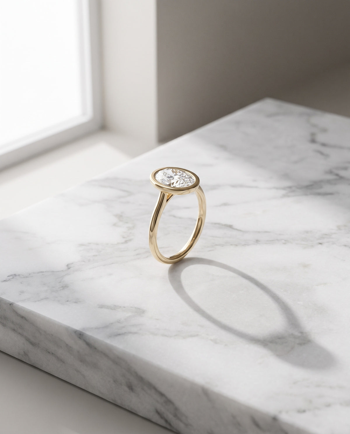 Levendi Wave of Love - Oval Cut Bezel Set Engagement Ring — Levendi Jewellers, on stone
