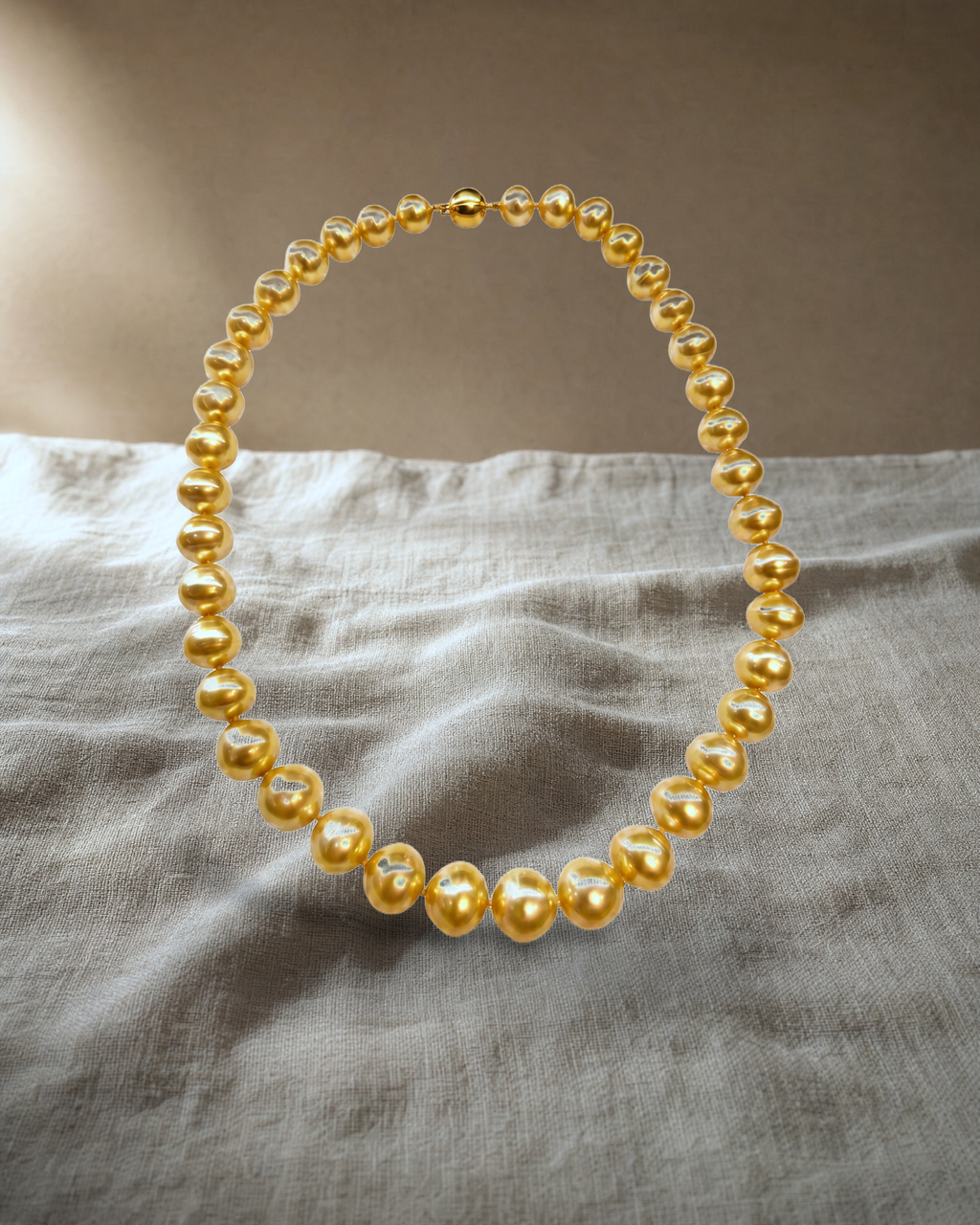 Gold Sea White Strand Necklace Graduated Oval — styled