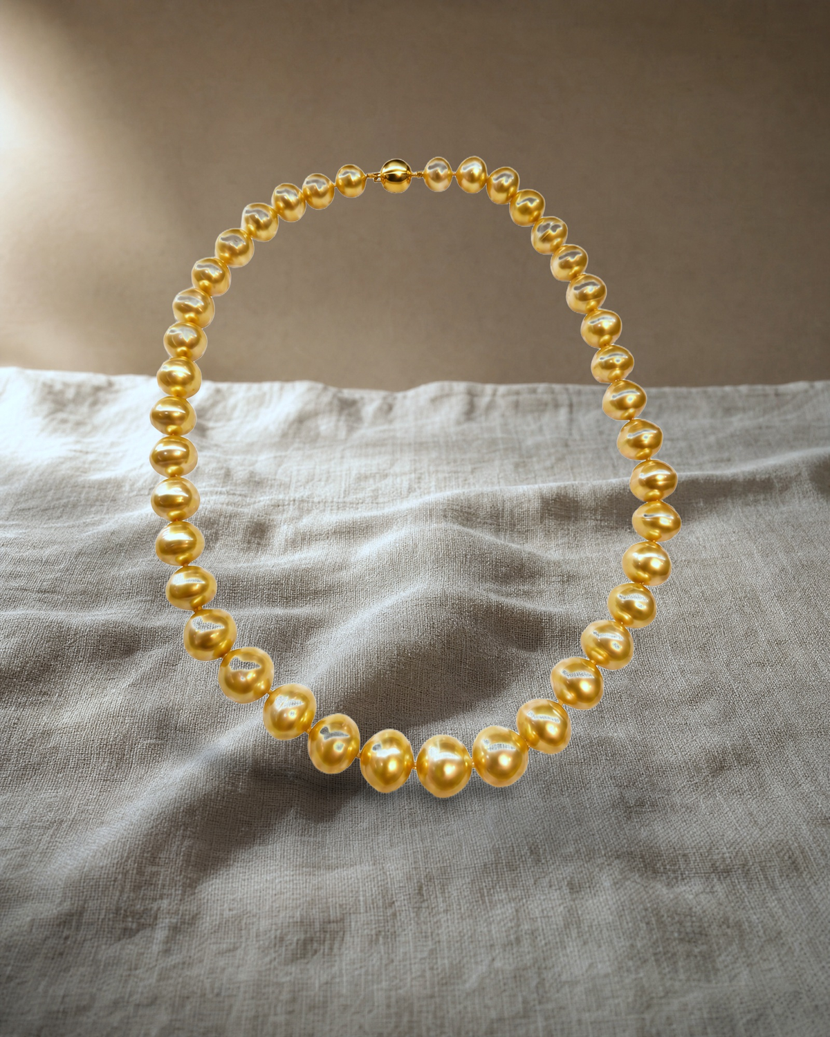 Gold Sea White Strand Necklace Graduated Oval — styled