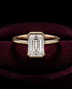 Levendi Wave of Love - Emerald Cut Open Bezel Engagement Ring — Levendi Jewellers, burgundy
