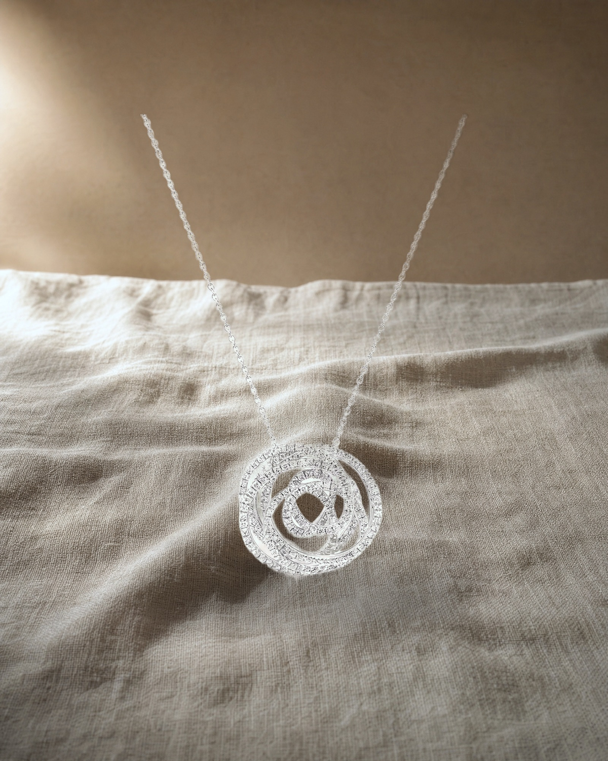 White Gold Diamond Swirl Pendant — styled