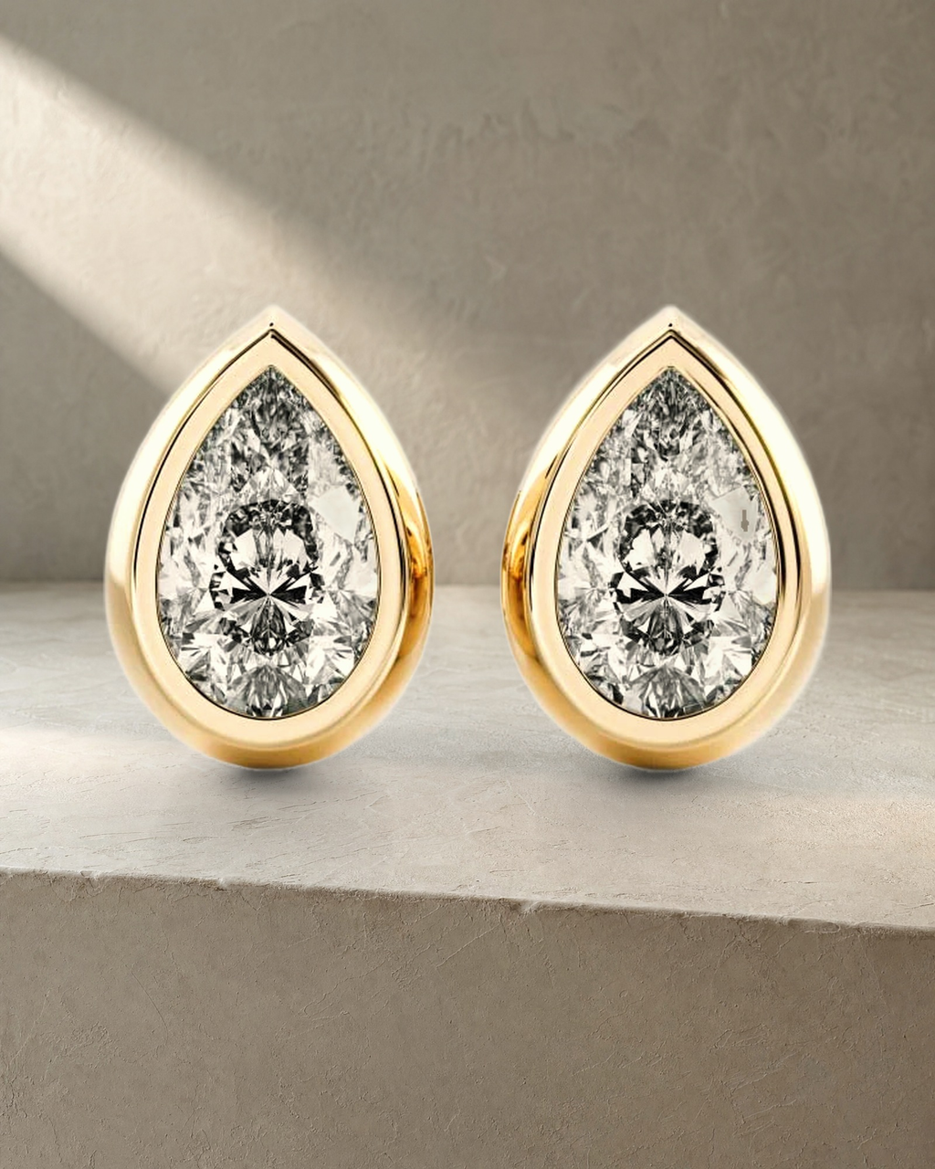 Classic Bezel Pear Cut Diamond Studs Earrings — styled