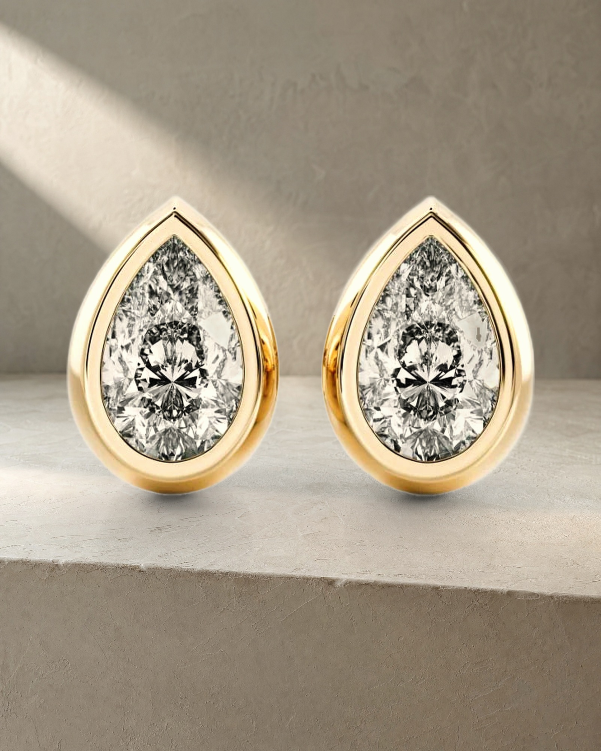 Classic Bezel Pear Cut Diamond Studs Earrings — styled