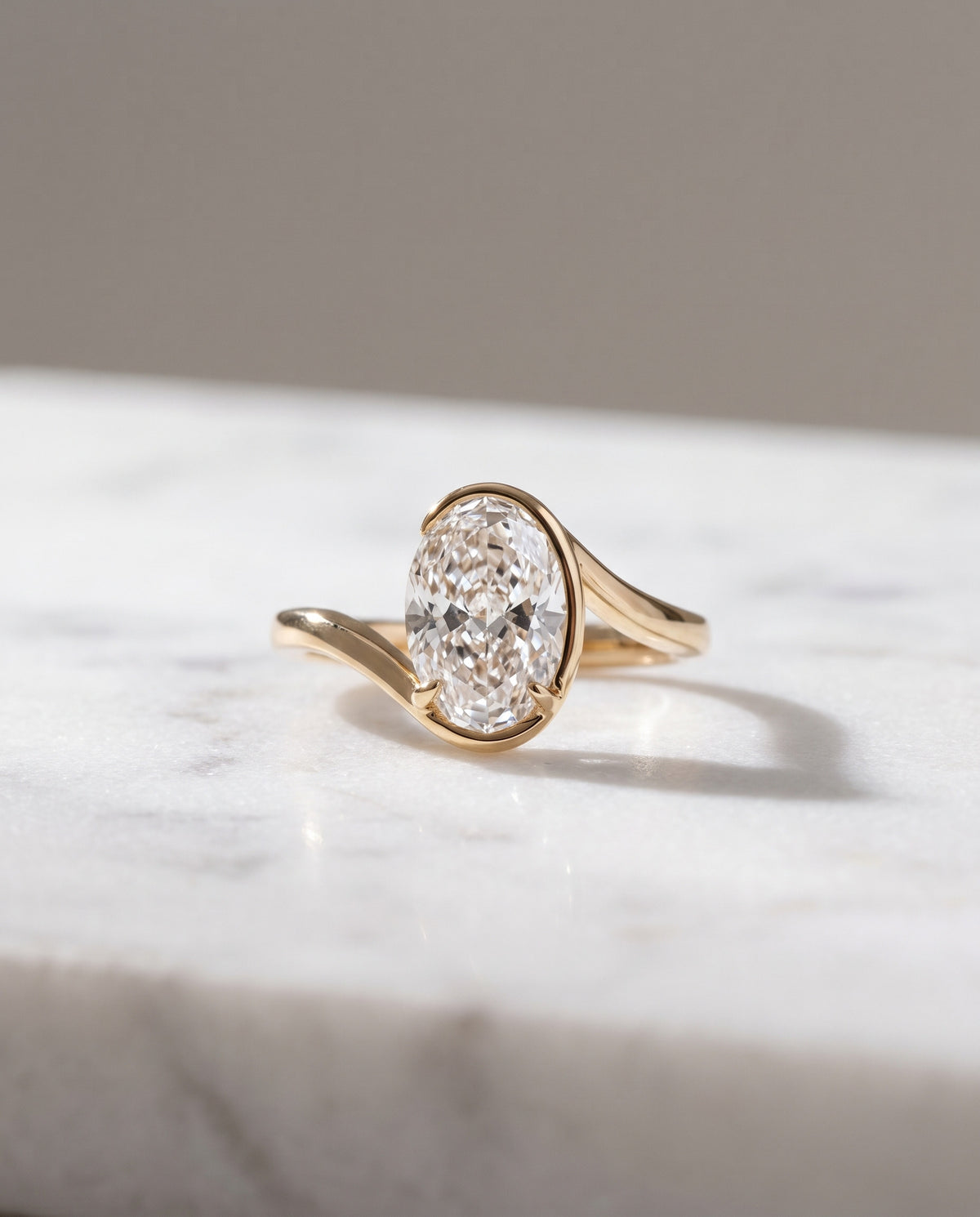Levendi Wave of Love - Oval Cut Bezel Engagement Ring — Levendi Jewellers, on stone