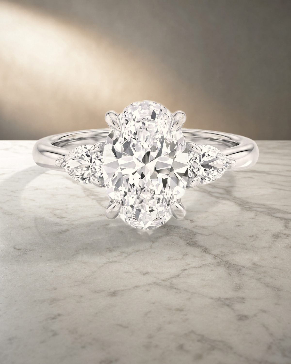 Levendi Classic Trilogy - Oval & Pear Side Engagement Ring — styled