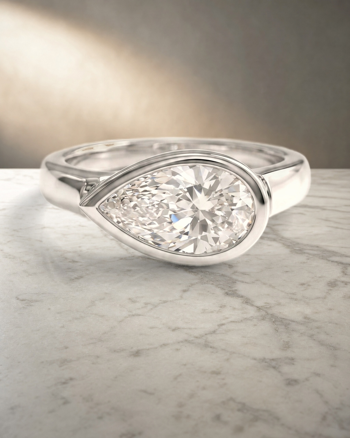 Levendi Wave of Love - East West Pear Cut Bezel Engagement Ring — styled