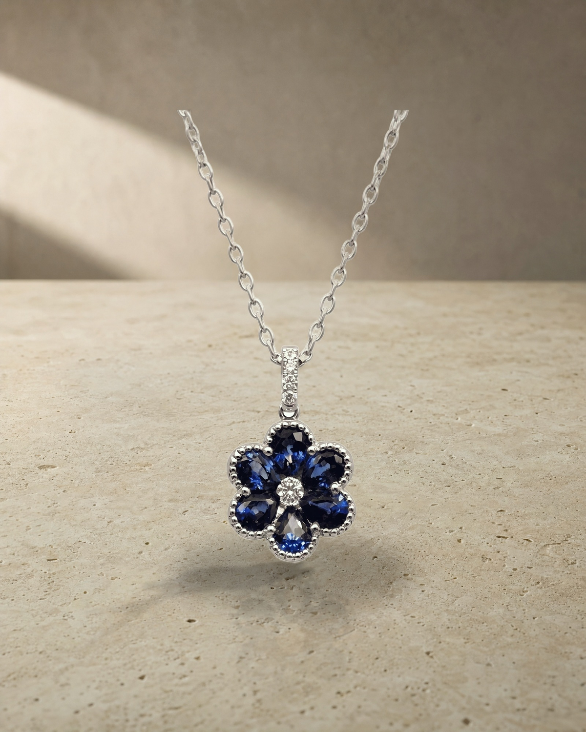 Levendi Essentials - Pear Cut Sapphires Emeralds & Diamonds Pendant — styled