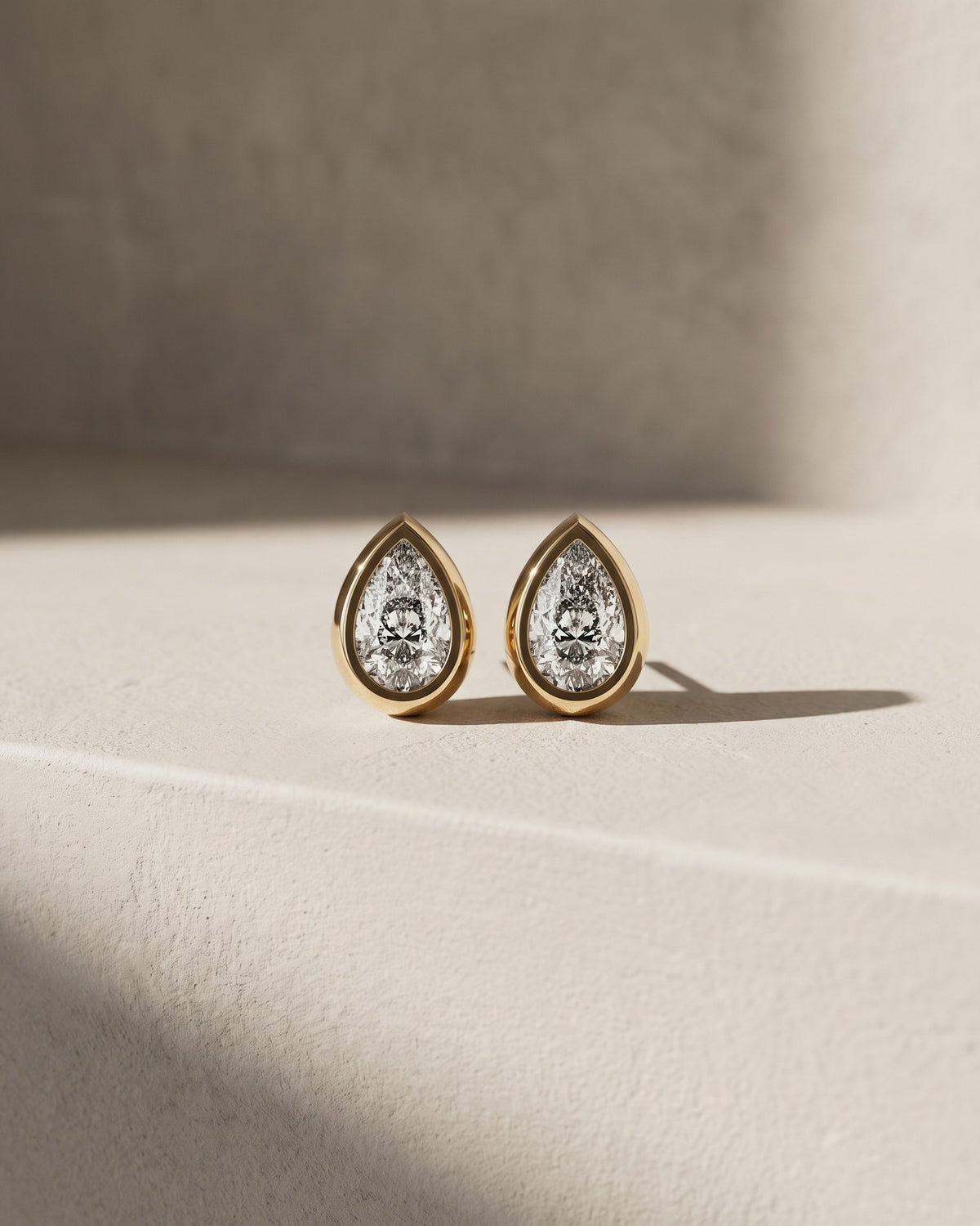 Classic Bezel Pear Cut Diamond Studs Earrings — Levendi Jewellers