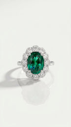 Oval Cut Emerald & Diamond Halo Ring