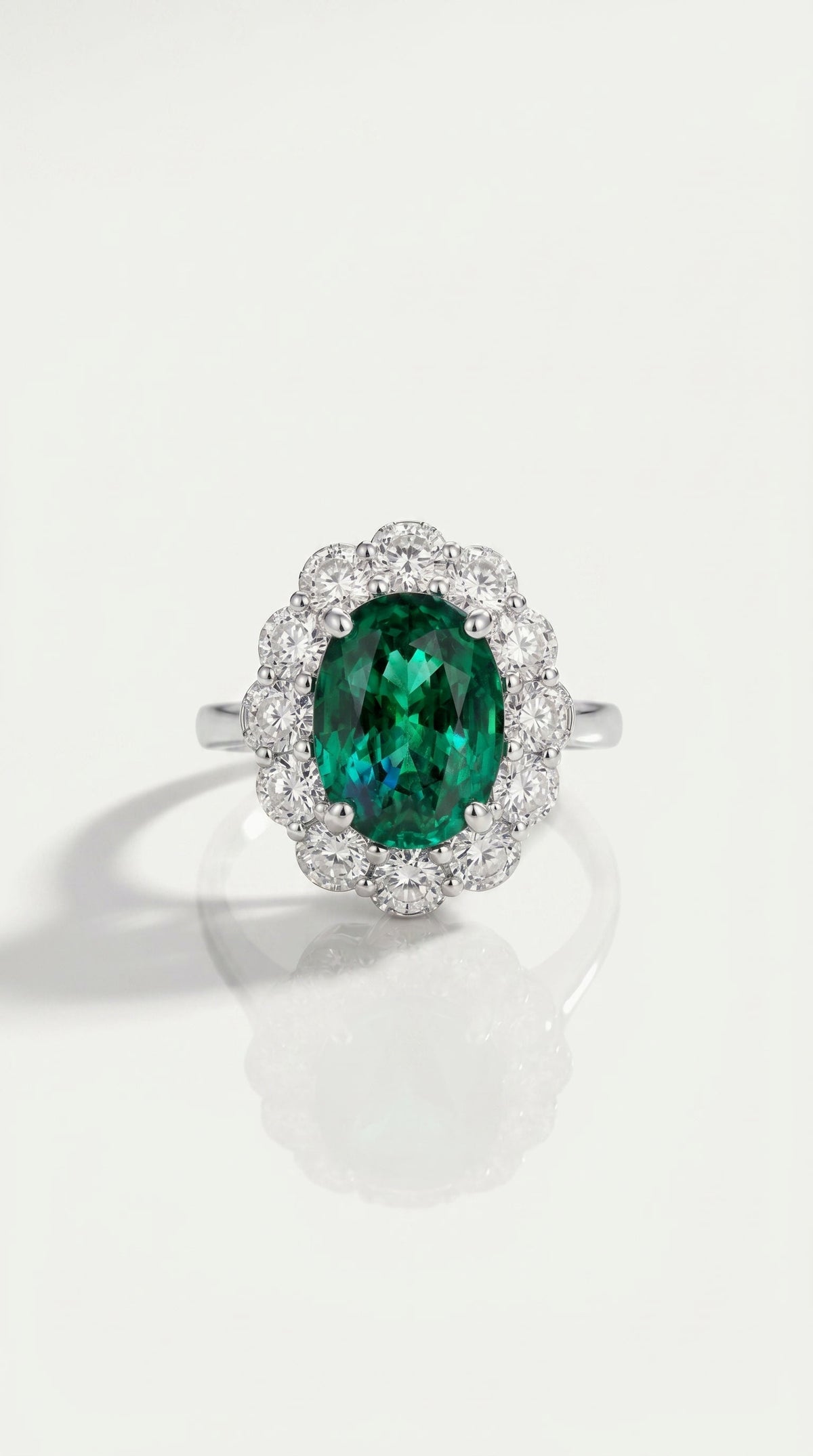 Oval Cut Emerald & Diamond Halo Ring