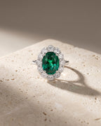 Oval Cut Emerald & Diamond Halo Ring — Levendi Jewellers