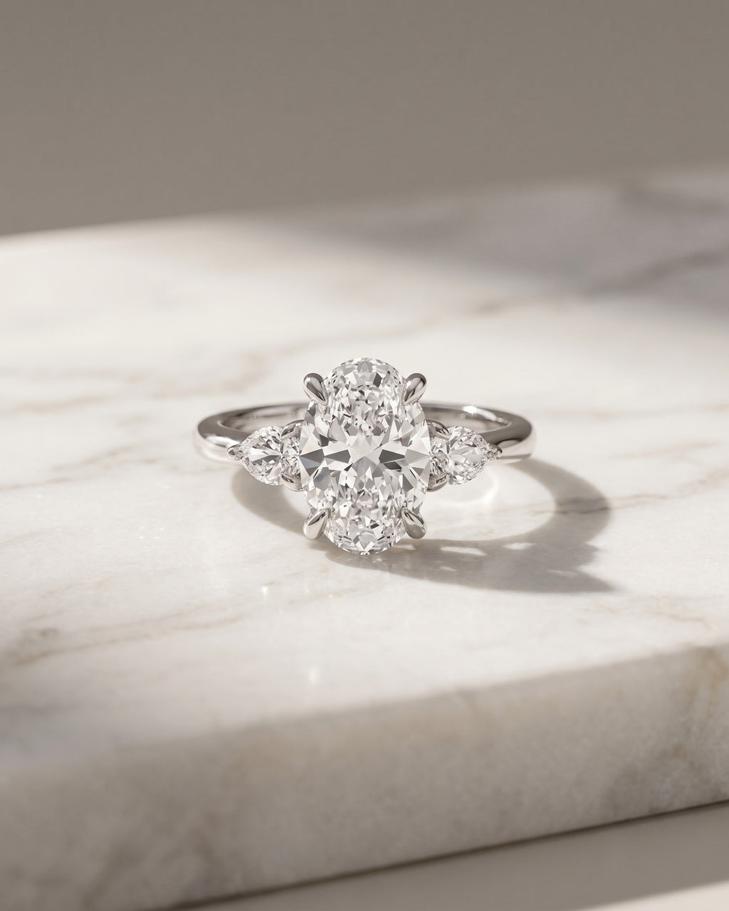 Levendi Classic Trilogy - Oval & Pear Side Engagement Ring — Levendi Jewellers
