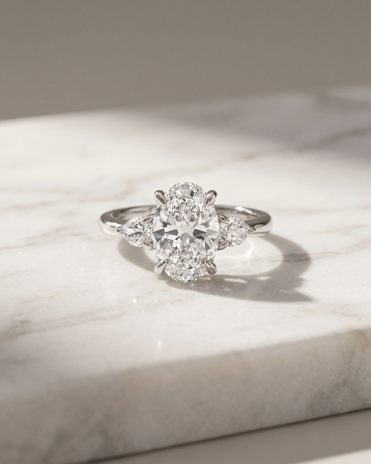 Levendi Classic Trilogy - Oval & Pear Side Engagement Ring — Levendi Jewellers