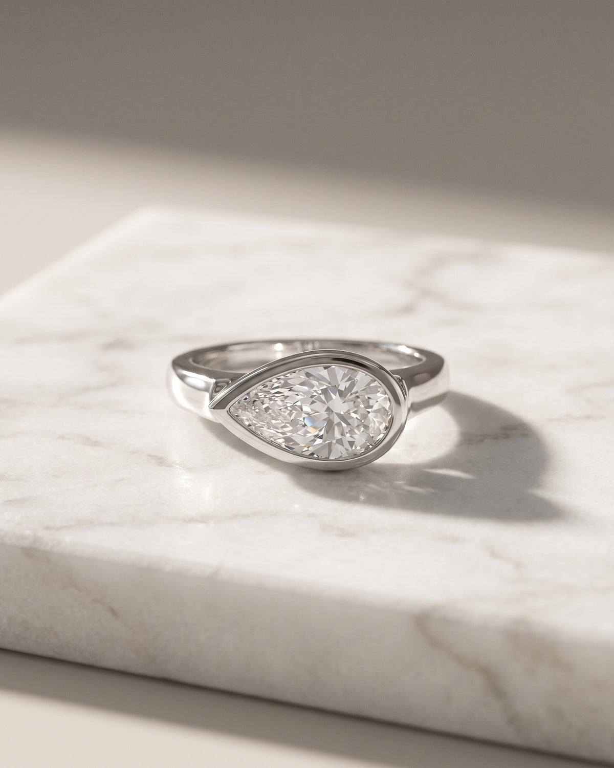 Levendi Wave of Love - East West Pear Cut Bezel Engagement Ring — Levendi Jewellers