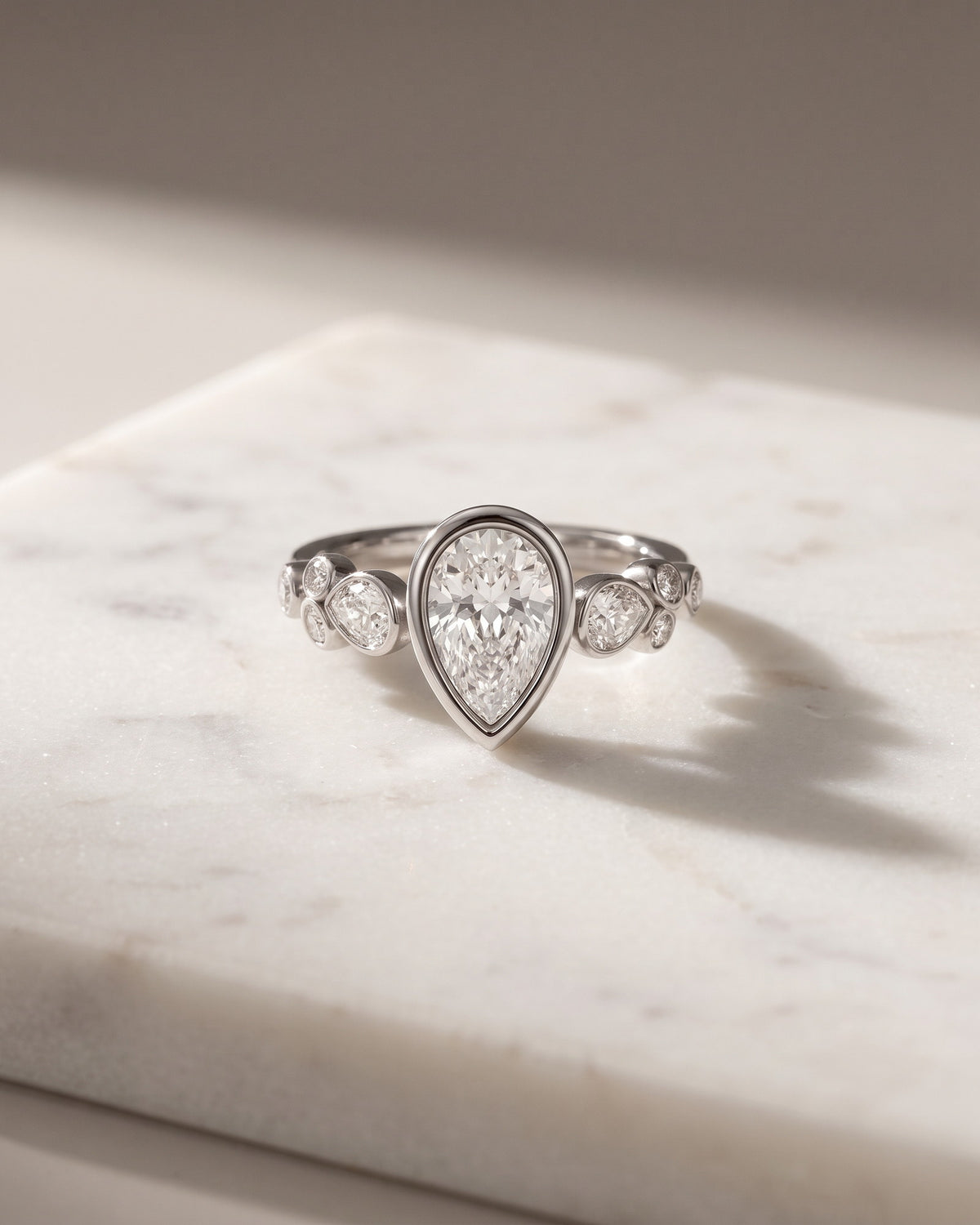 Levendi Wave of Love - Pear Cut Bezel & Mix Shape Engagement Ring — Levendi Jewellers